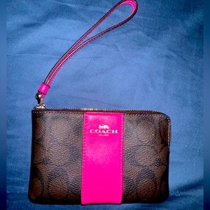 Brown and pink small COACH wristlet. Never used.